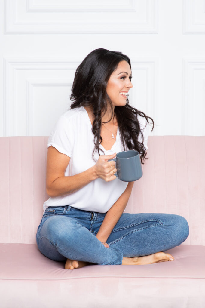 Woman on pink sofa