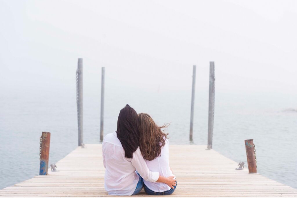 two women on a dock by the water