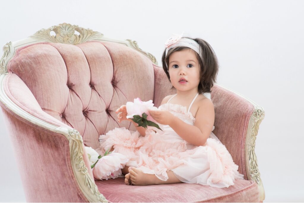 girl in a pink chair
