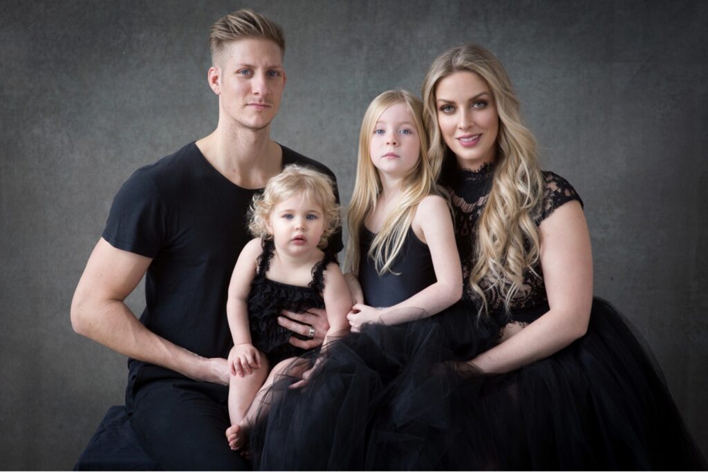 family on a black backdrop